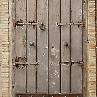 old medieval door with rusty bottom