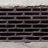 rusty_sewer_manhole_square_holes_20131007_1983595820
