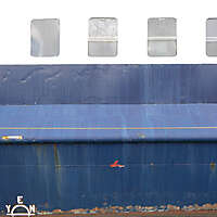 rusty paint ship hull with windows 2