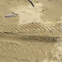 dirtbike tracks on sand
