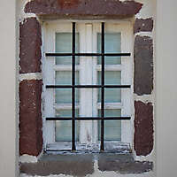 old_barred_window_with_stone_frame_10_20130927_1267267608