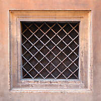 old barred window with stone frame 2