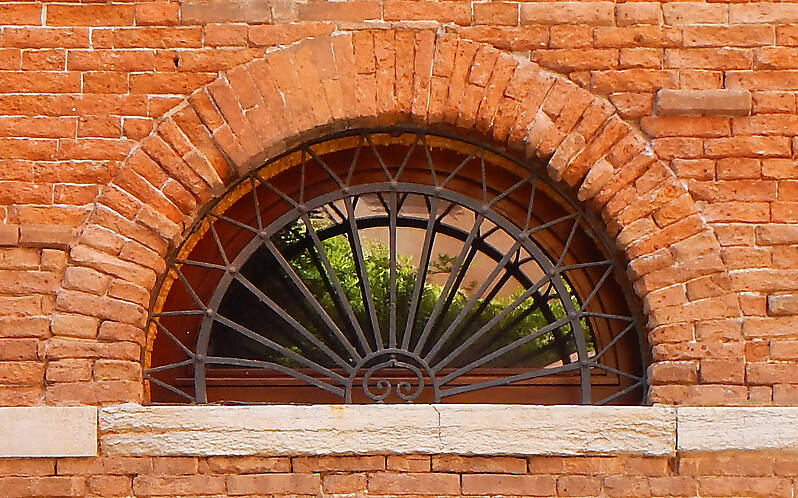 rounded window with cage