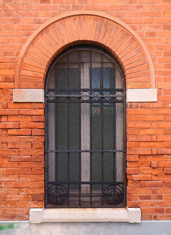 rounded window with cage 2