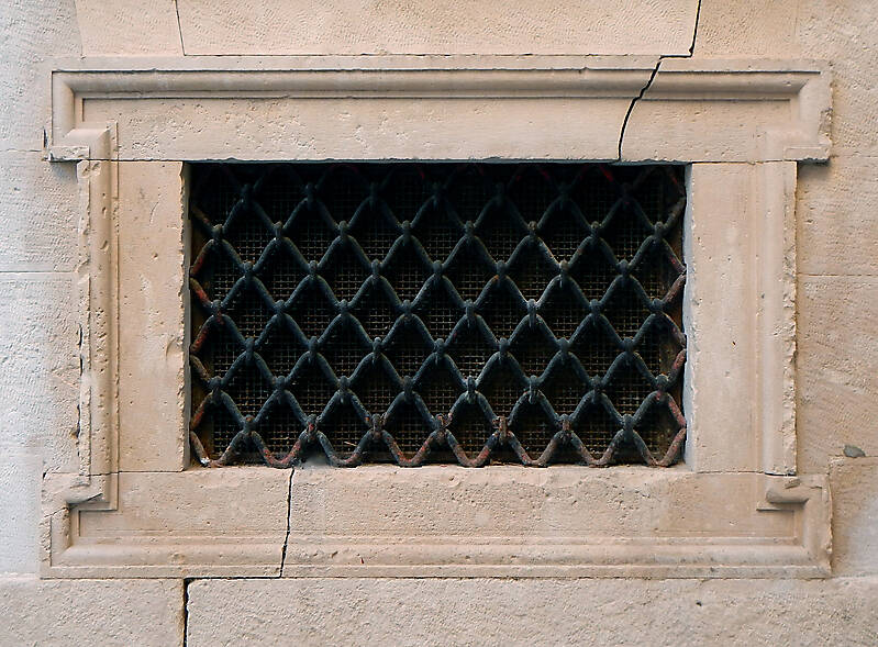 old medieval window with grate 3