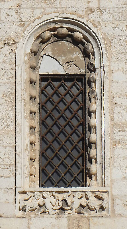 old medieval window with grate 7