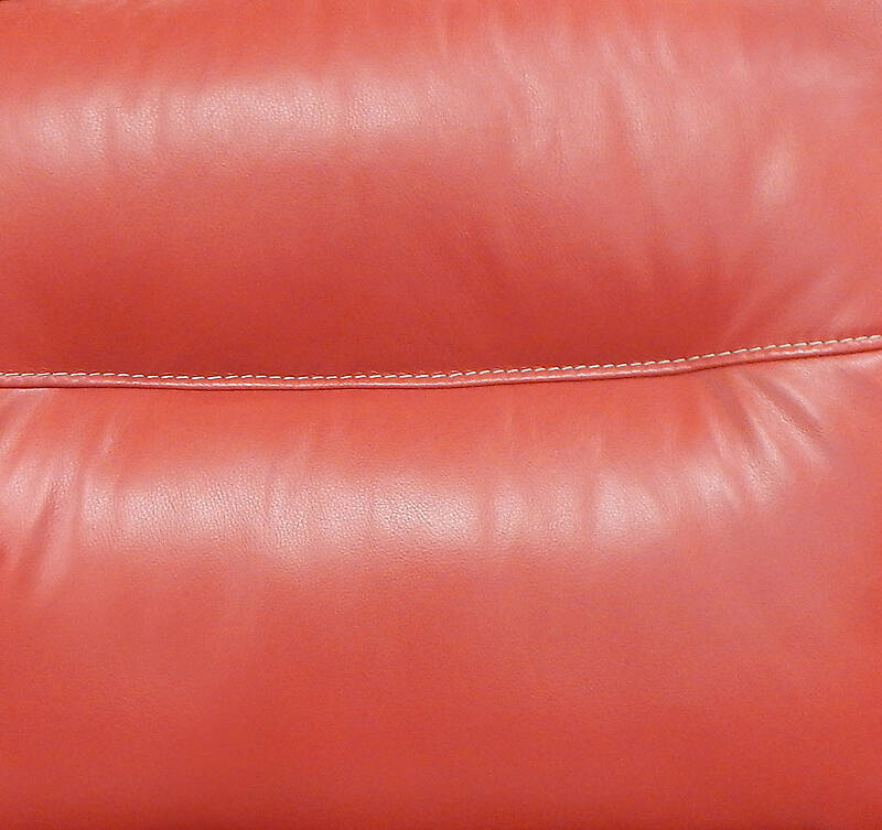 red leather backrest couch with sewings