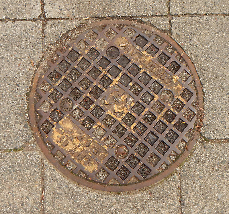 rusty round manhole big 3