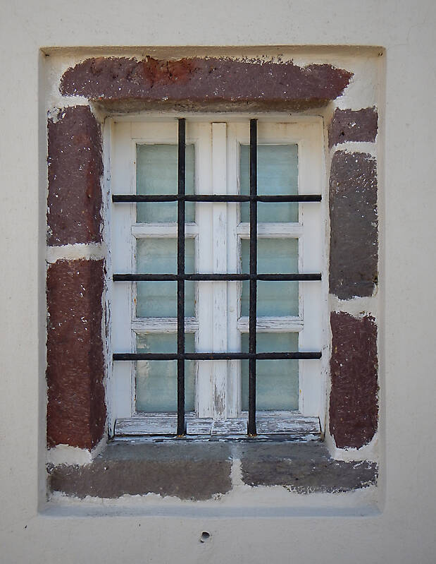 old barred window with stone frame 10