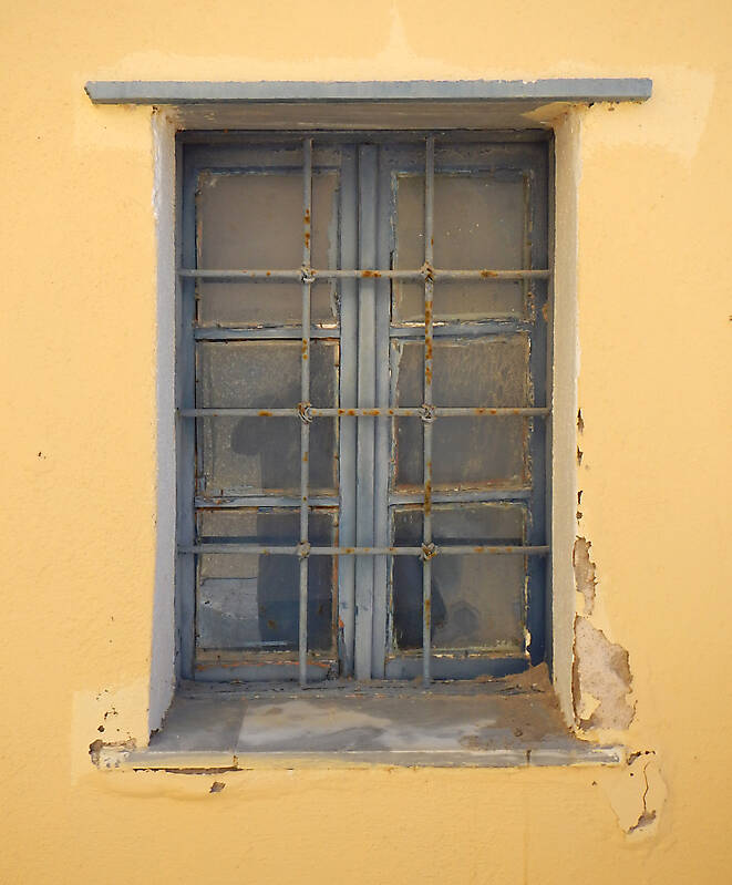 old barred window with stone frame 13