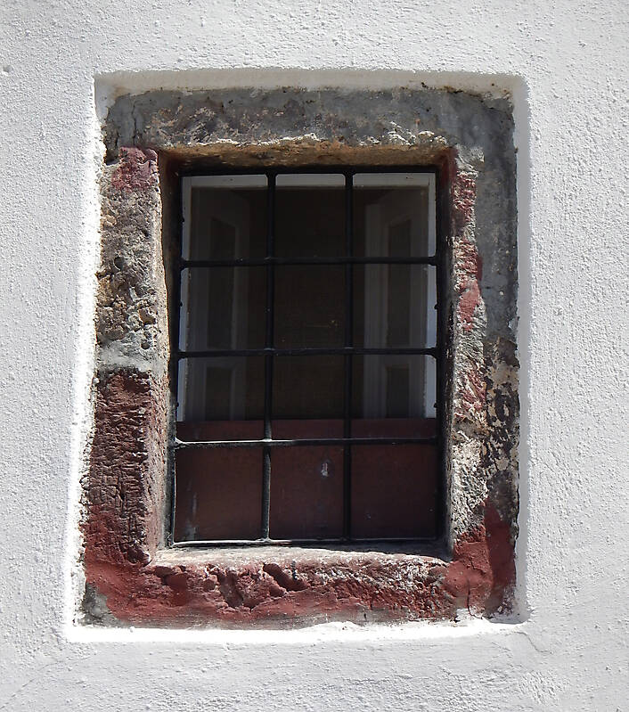 old barred window with stone frame 12