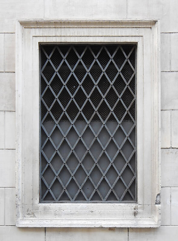 old barred window with stone frame 17